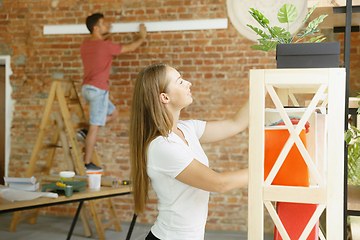 Image showing Young couple doing apartment repair together themselves