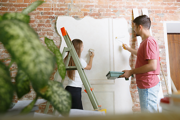 Image showing Young couple doing apartment repair together themselves