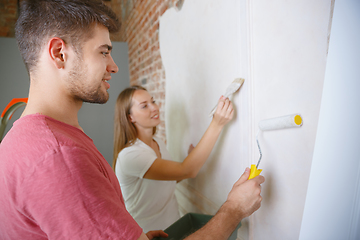 Image showing Young couple doing apartment repair together themselves