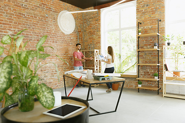 Image showing Young couple doing apartment repair together themselves