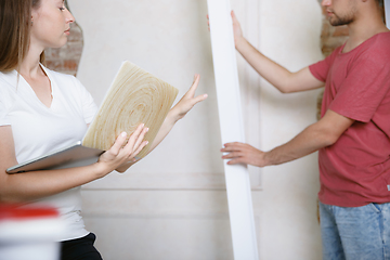 Image showing Young couple doing apartment repair together themselves