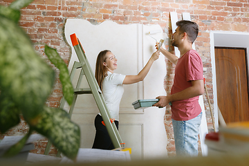 Image showing Young couple doing apartment repair together themselves