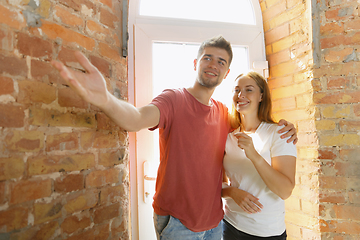 Image showing Young couple doing apartment repair together themselves