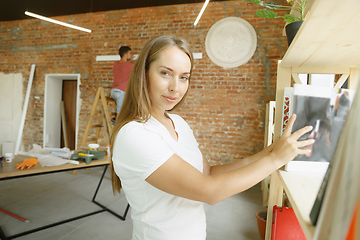 Image showing Young couple doing apartment repair together themselves