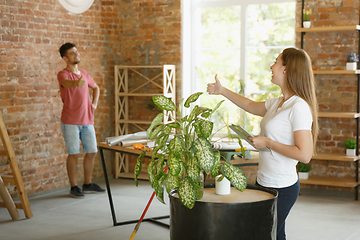 Image showing Young couple doing apartment repair together themselves