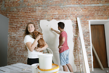 Image showing Young couple doing apartment repair together themselves