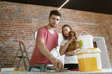 Image showing Young couple doing apartment repair together themselves