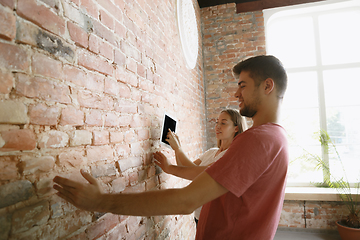 Image showing Young couple doing apartment repair together themselves