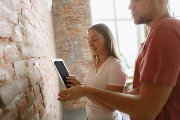 Image showing Young couple doing apartment repair together themselves