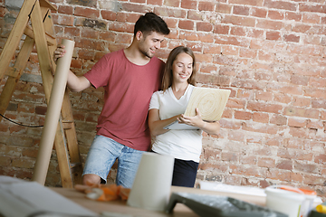 Image showing Young couple doing apartment repair together themselves