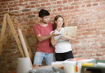 Image showing Young couple doing apartment repair together themselves