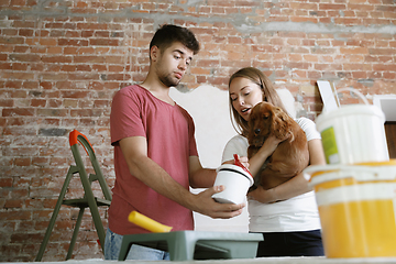 Image showing Young couple doing apartment repair together themselves