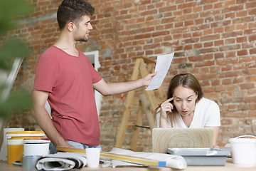 Image showing Young couple doing apartment repair together themselves