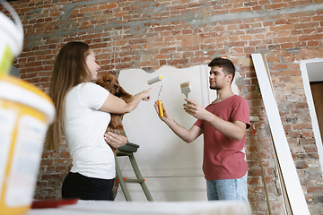 Image showing Young couple doing apartment repair together themselves