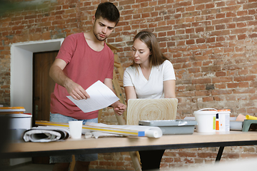 Image showing Young couple doing apartment repair together themselves