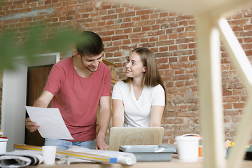 Image showing Young couple doing apartment repair together themselves