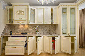 Image showing Front view of luxury modern neoclassic beige kitchen interior