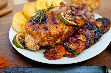 Image showing roasted grilled BBQ chicken breast with herbs and spices 