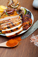 Image showing roasted grilled BBQ chicken breast with herbs and spices 