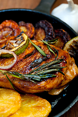 Image showing roasted grilled BBQ chicken breast with herbs and spices 