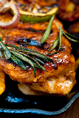 Image showing roasted grilled BBQ chicken breast with herbs and spices 