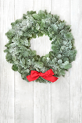 Image showing Winter Solstice Wreath with Fir and Red Bow