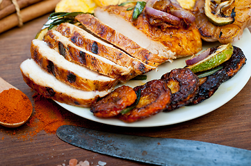 Image showing roasted grilled BBQ chicken breast with herbs and spices 