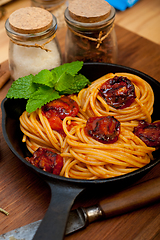 Image showing italian spaghetti pasta and tomato with mint leaves 