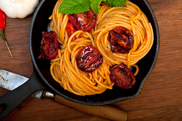 Image showing italian spaghetti pasta and tomato with mint leaves 