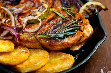 Image showing roasted grilled BBQ chicken breast with herbs and spices 