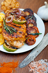 Image showing roasted grilled BBQ chicken breast with herbs and spices 