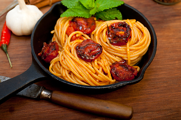 Image showing italian spaghetti pasta and tomato with mint leaves 