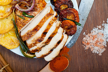 Image showing roasted grilled BBQ chicken breast with herbs and spices 