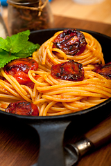 Image showing italian spaghetti pasta and tomato with mint leaves 