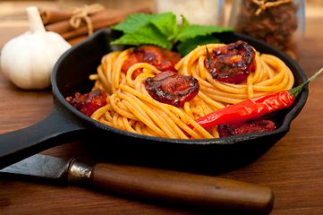 Image showing italian spaghetti pasta and tomato with mint leaves 