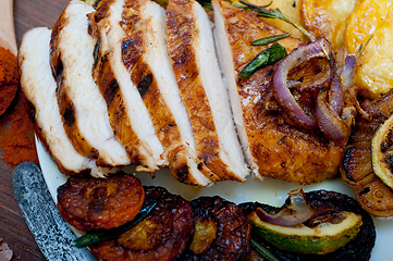 Image showing roasted grilled BBQ chicken breast with herbs and spices 