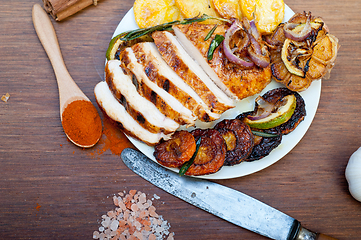 Image showing roasted grilled BBQ chicken breast with herbs and spices 