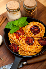 Image showing italian spaghetti pasta and tomato with mint leaves 