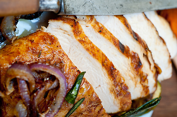 Image showing roasted grilled BBQ chicken breast with herbs and spices 