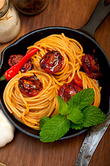 Image showing italian spaghetti pasta and tomato with mint leaves 