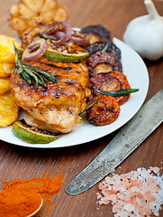 Image showing roasted grilled BBQ chicken breast with herbs and spices 