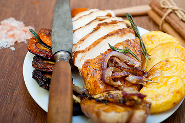 Image showing roasted grilled BBQ chicken breast with herbs and spices 