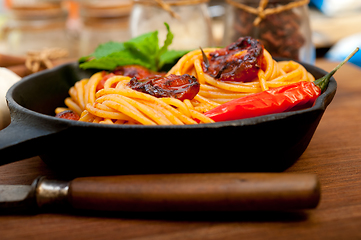 Image showing italian spaghetti pasta and tomato with mint leaves 