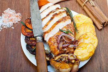 Image showing roasted grilled BBQ chicken breast with herbs and spices 