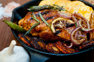 Image showing roasted grilled BBQ chicken breast with herbs and spices 