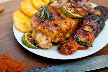 Image showing roasted grilled BBQ chicken breast with herbs and spices 