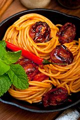 Image showing italian spaghetti pasta and tomato with mint leaves 