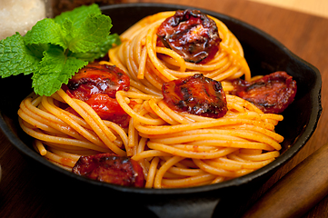 Image showing italian spaghetti pasta and tomato with mint leaves 