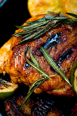 Image showing roasted grilled BBQ chicken breast with herbs and spices 