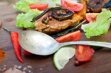 Image showing wood fired hoven cooked chicken breast on wood board 